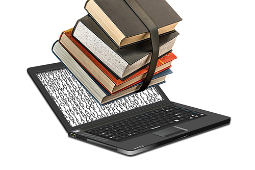 Laptop och böcker