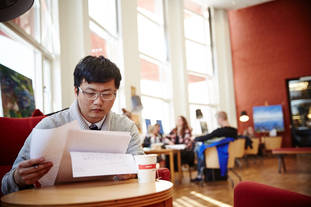 Shangqian, student, in the university library