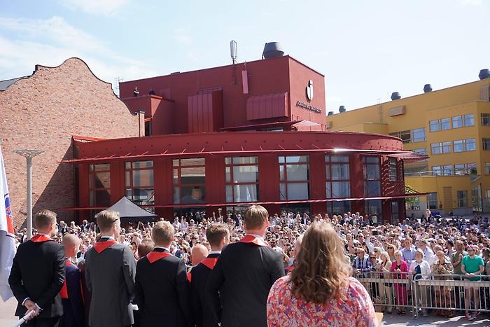 Students from the back and the crowd.