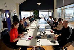 Group of people around a boardroom table