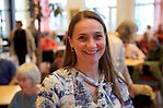 Leende kvinna efter föreläsning.