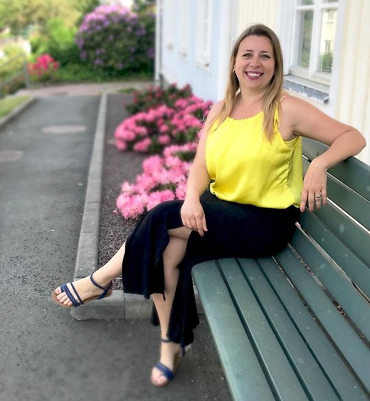 Smiling woman sitting on bench