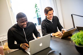 Two students sitting at a table